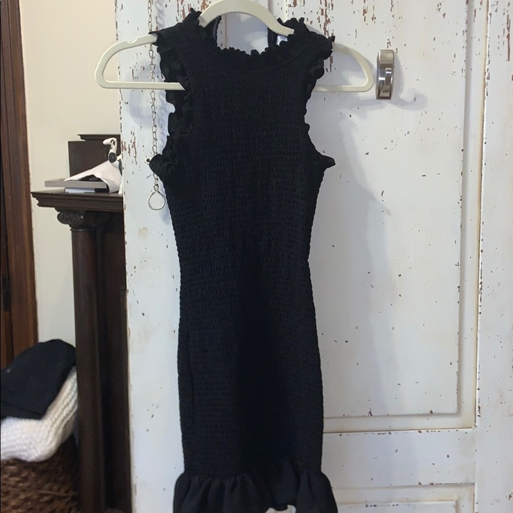 Likely black ruffle dress